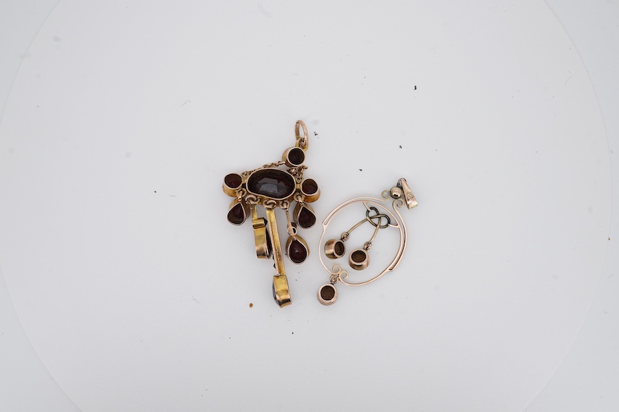 An early 20th century yellow metal and garnet cluster set drop pendant, 46mm, together with a similar opal set drop pendant, stamped '9', 37mm, gross weight 4.5 grams. Condition - fair to good